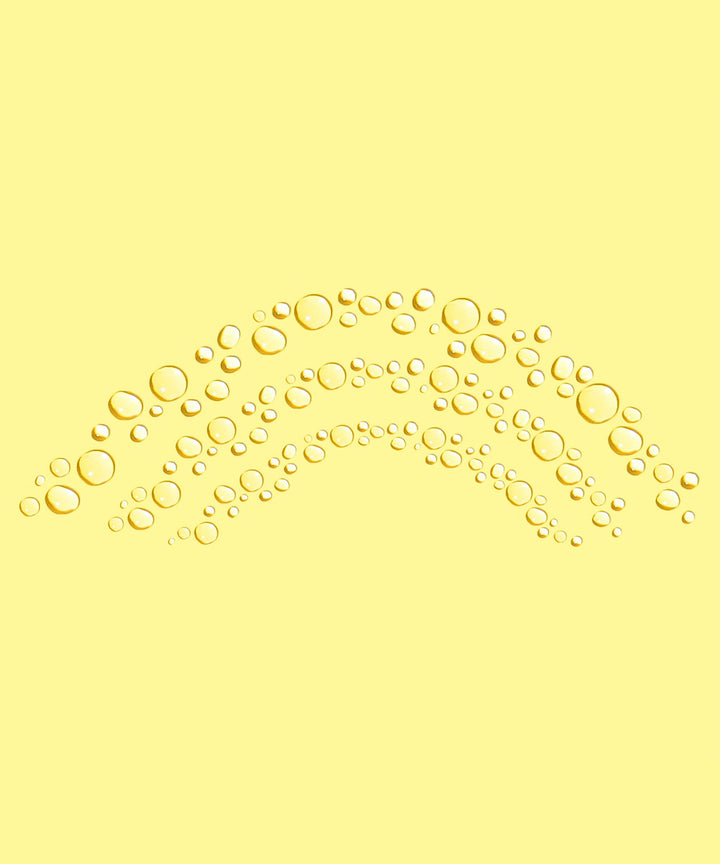Yellow background with arranged droplets showcasing Daily Sunscreen Face Mist SPF 30 by Sun Bum.