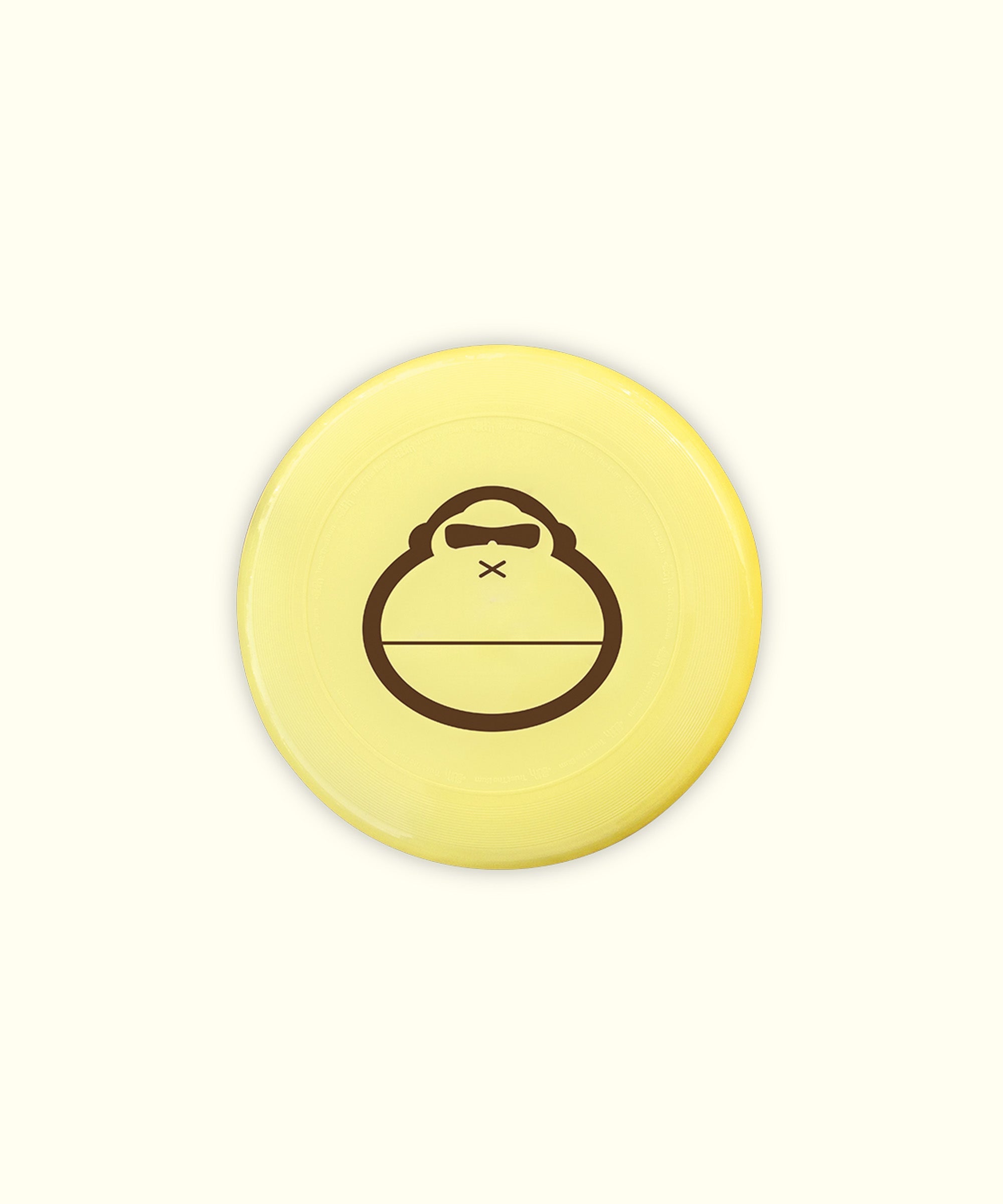 Yellow ultimate disc with a playful monkey logo, perfect for beach games, Sun Bum.