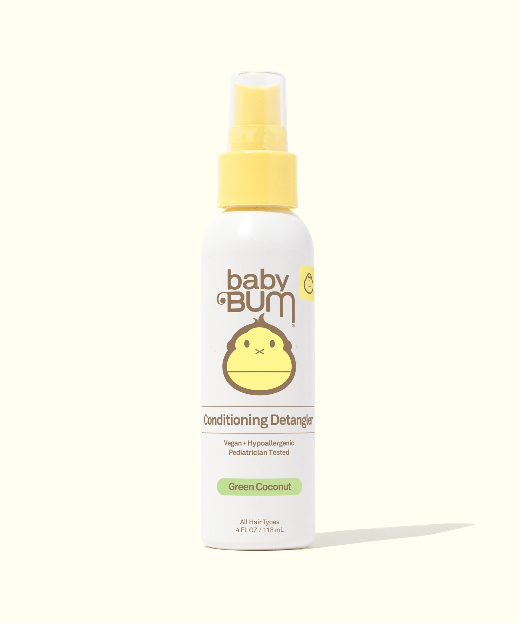 Baby Bum Conditioning Detangler spray bottle on a light background, labeled "Green Coconut" for all hair types, Baby Bum.