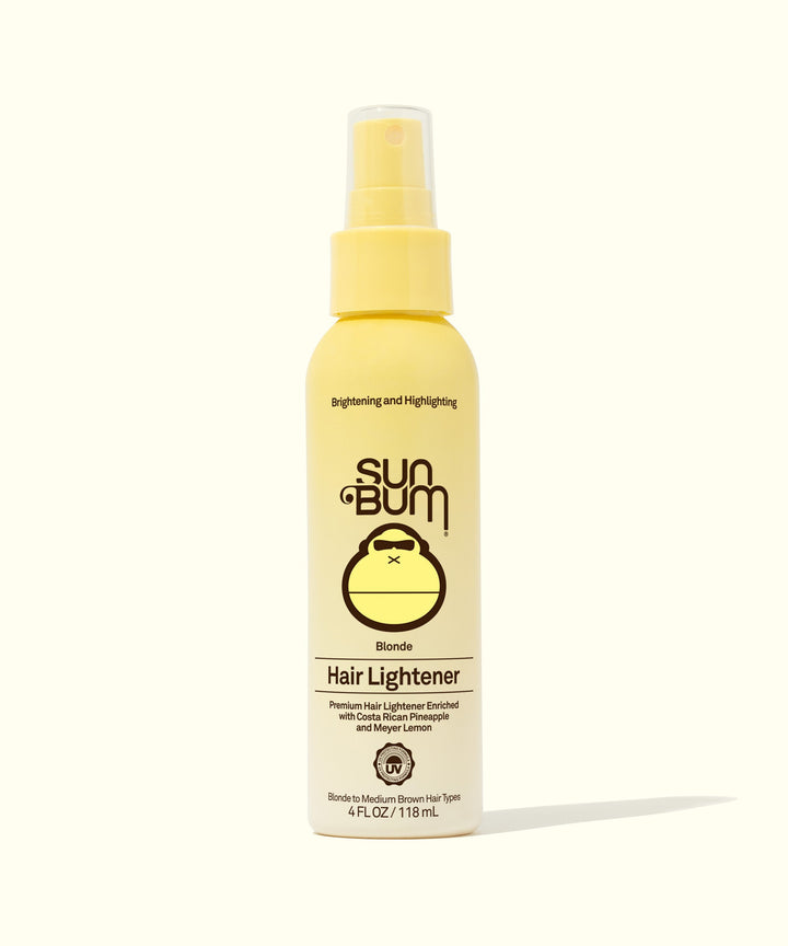 Yellow bottle of Sun Bum Blonde Hair Lightener spray, infused with Costa Rican Pineapples and Meyer Lemons for natural sun highlighting. Sun Bum,