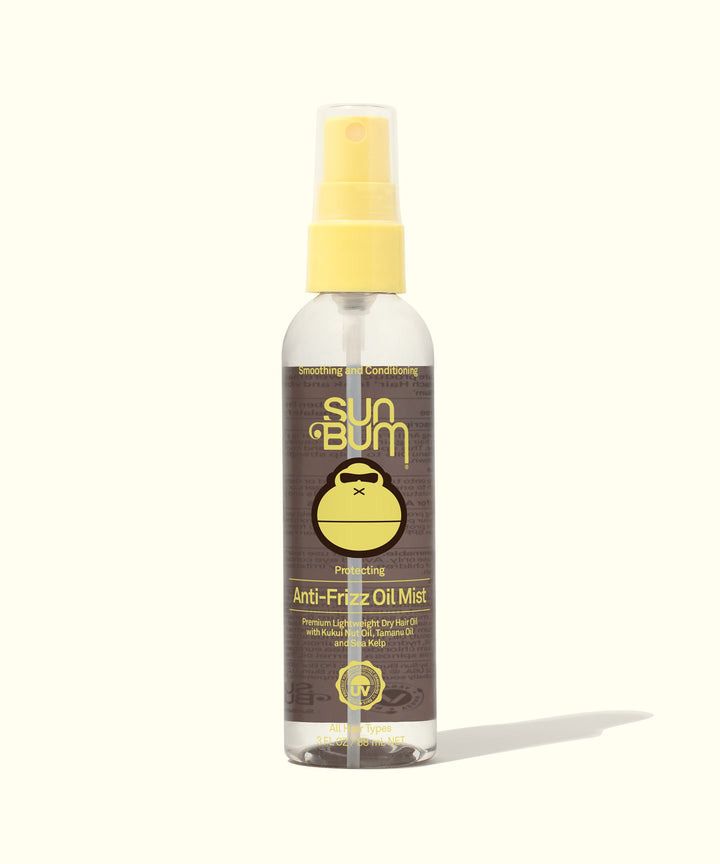 Clear bottle of lightweight Anti-Frizz Oil Mist with Kukui Nut Oil and Tamanu Oil for humidity and frizz control, by Sun Bum.