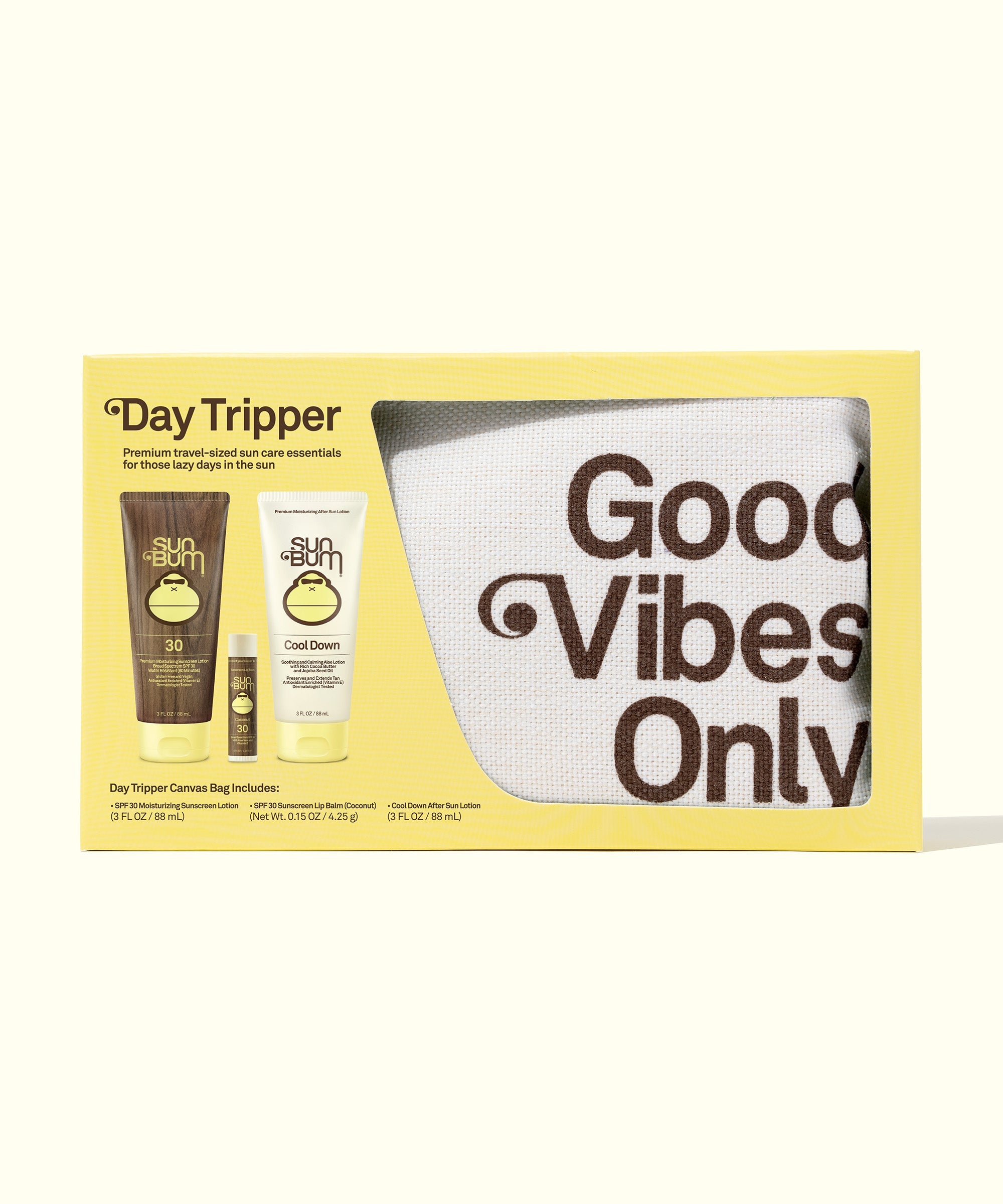 Travel-sized sun care essentials including sunscreen, lip balm, and a cooling gel in a kit with a "Good Vibes Only" pouch, perfect for travelers. Sun Bum.