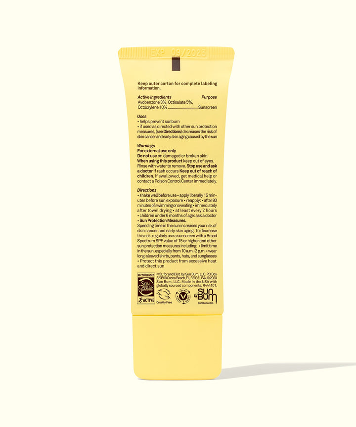 Back view of a yellow tube of Original Glow SPF 30 Sunscreen Face Lotion showing product details and ingredients, made with Kakadu Plum to enhance skin luminosity and sun protection, Sun Bum.