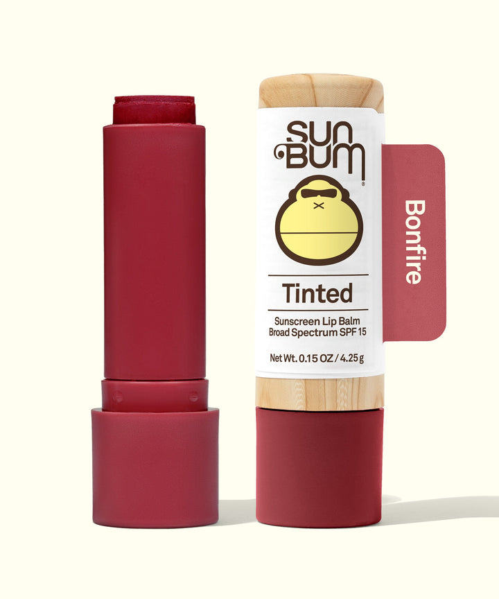 Tinted SPF 15 Lip Balm in Bonfire shade, offering lip protection with a hint of color, by Sun Bum.