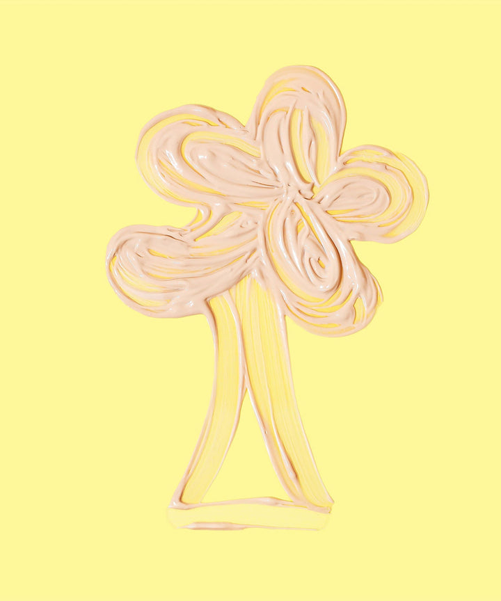 Swirled cream in the shape of a palm tree, representing the lightweight and hydrating Daily Mineral Sunscreen Moisturizer SPF 30 with ingredients like Banana, Wild Rosella, and Niacinamide. Sun Bum