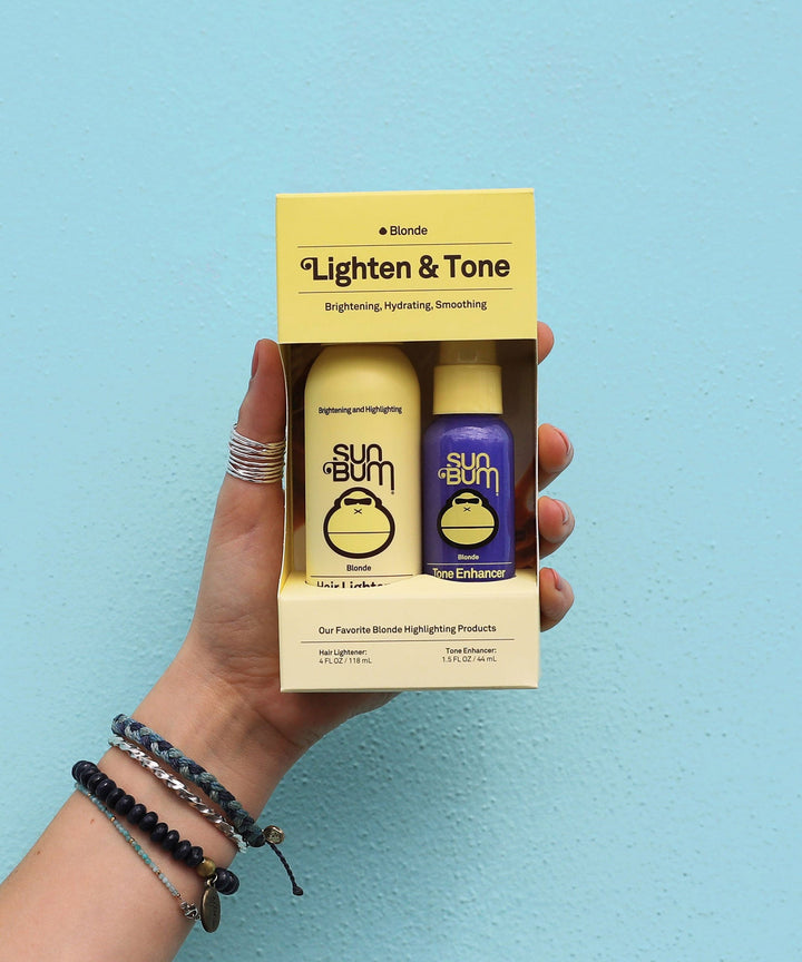 Blonde Lighten & Tone Kit for brightening, hydrating, and smoothing hair, featuring Sun Bum products.